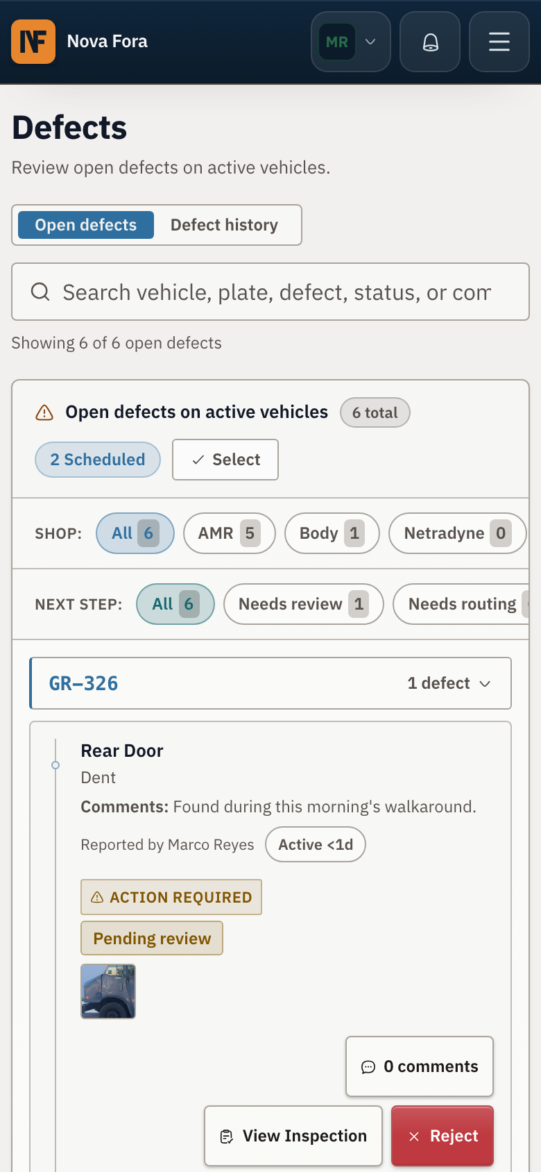 Mobile inspection record showing a rear door dent and its photo